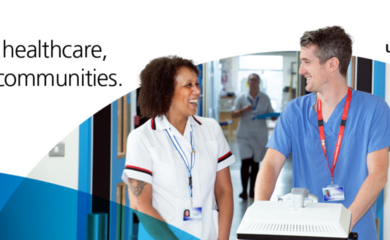 Two hospital colleagues smiling at each other. Text reads 'Leading in healthcare, trusted in communities.'