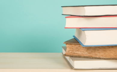 A pile of books on blue background