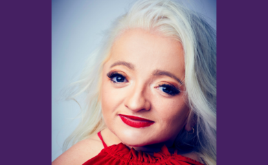 Samantha wearing a red top and lipstick