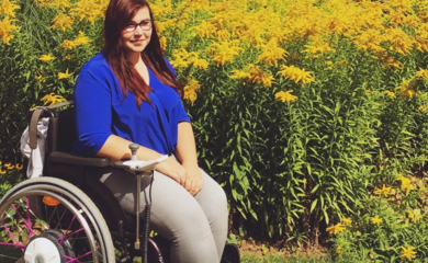 Holly sitting in her wheelchair