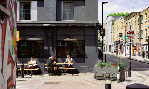 Image of people sitting outside an Allpress Expresso cafe.