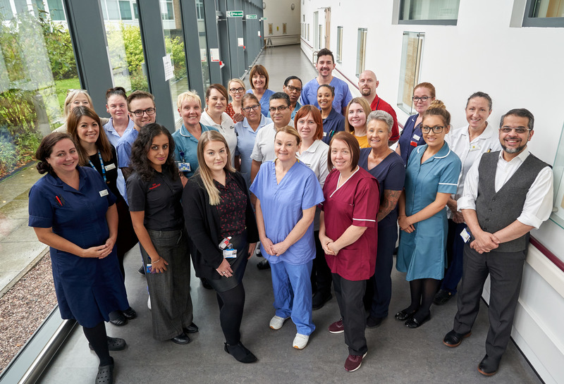 A group of hospital staff in a corridor