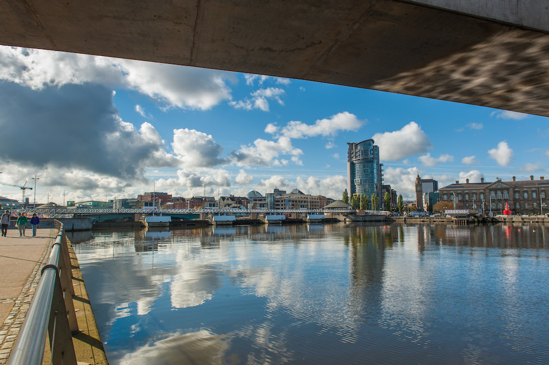 "Queen's University Belfast with large water area in the foreground"