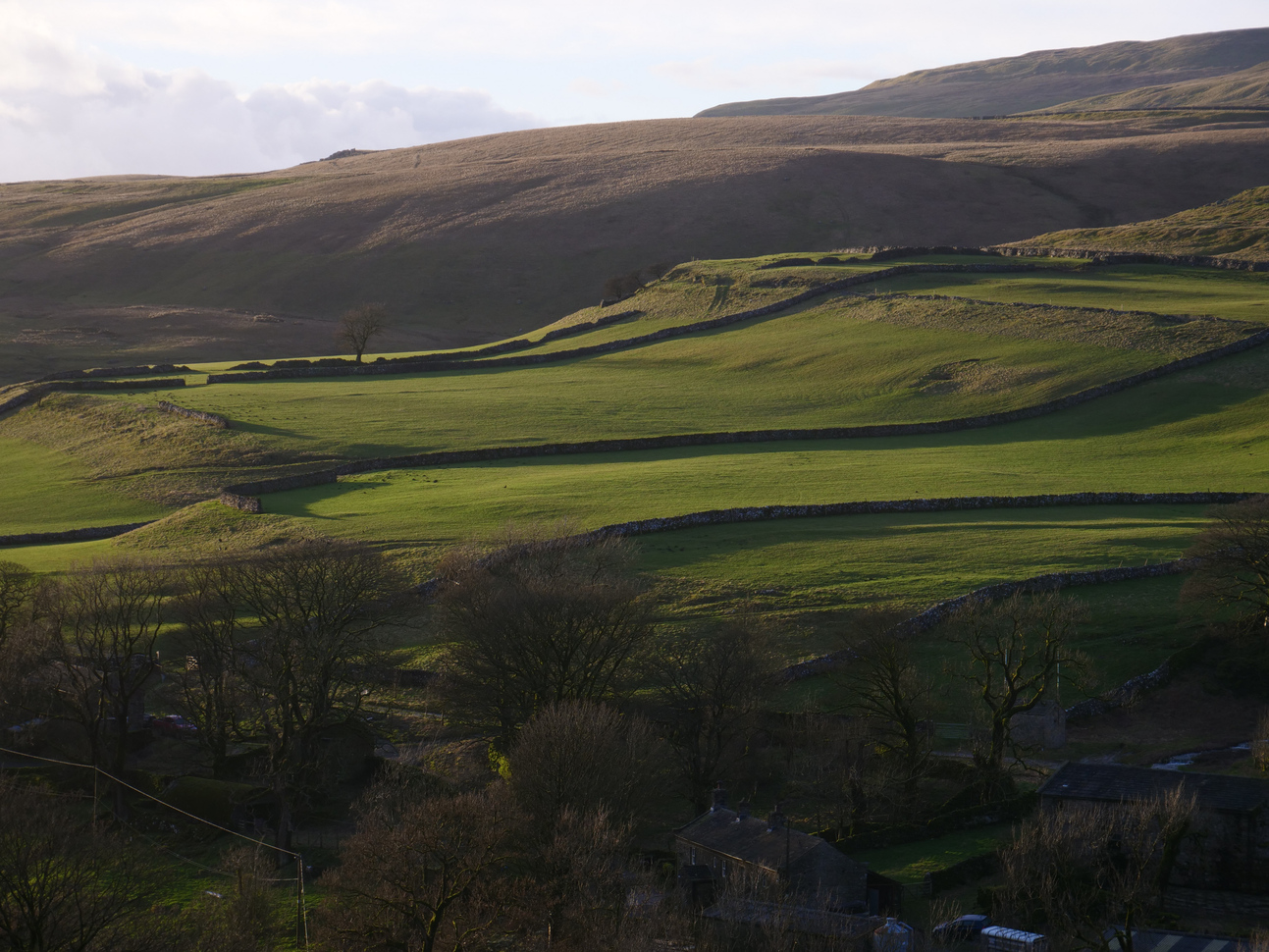 View over the landscape of the fields and hills on Cray in the Yorkshire Dales.