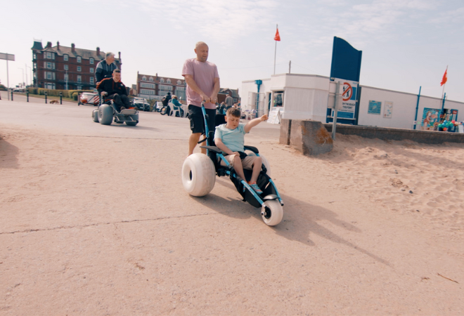 Someone using a beach wheelchair
