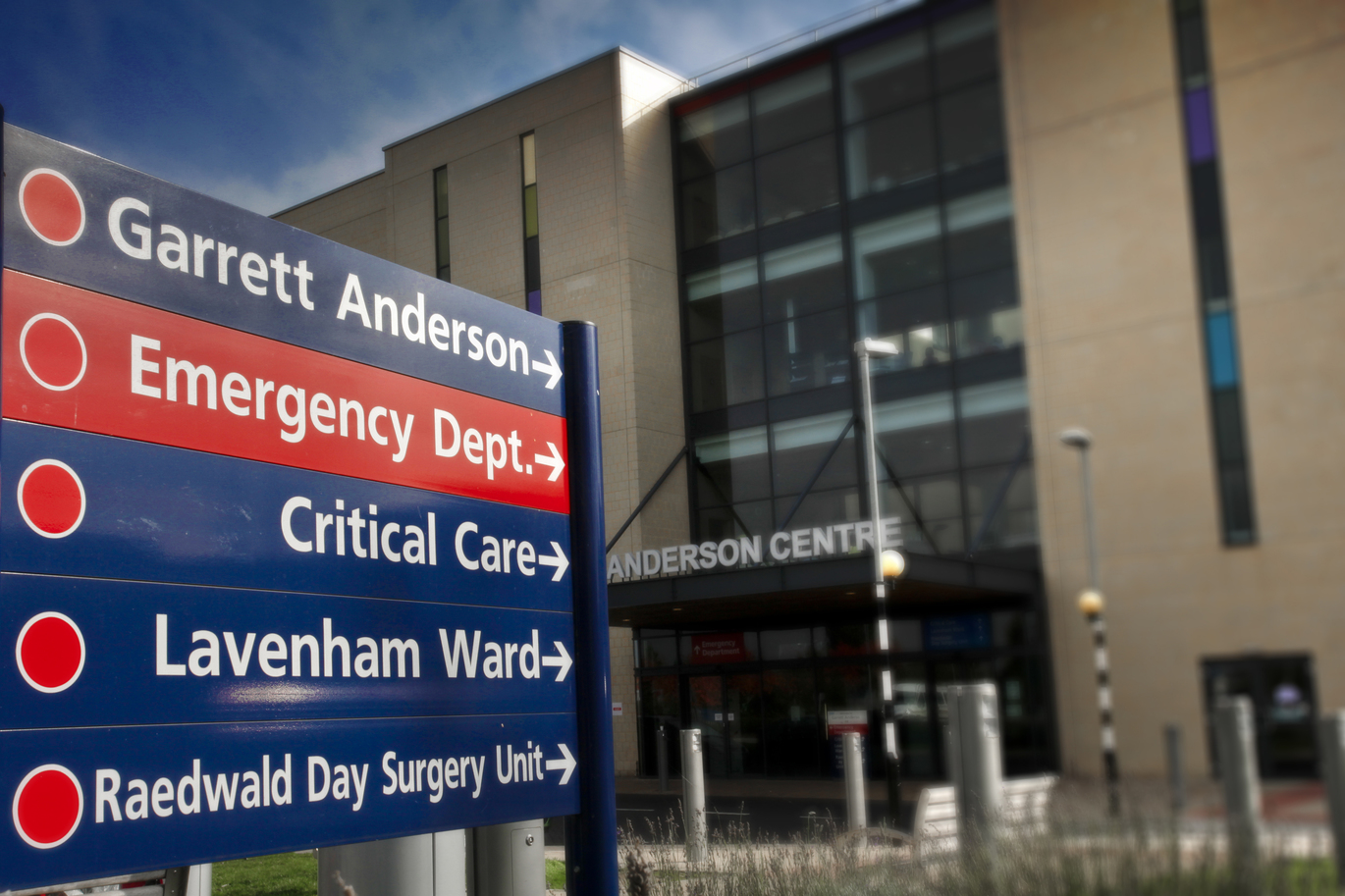Photo of signage to multiple departments out the front of the hospital