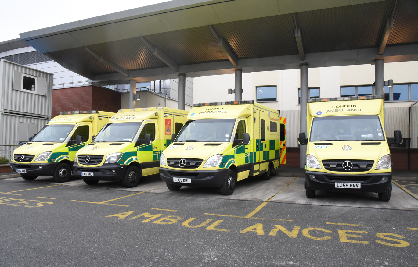 "Ambulances lined up outside of the hospital"