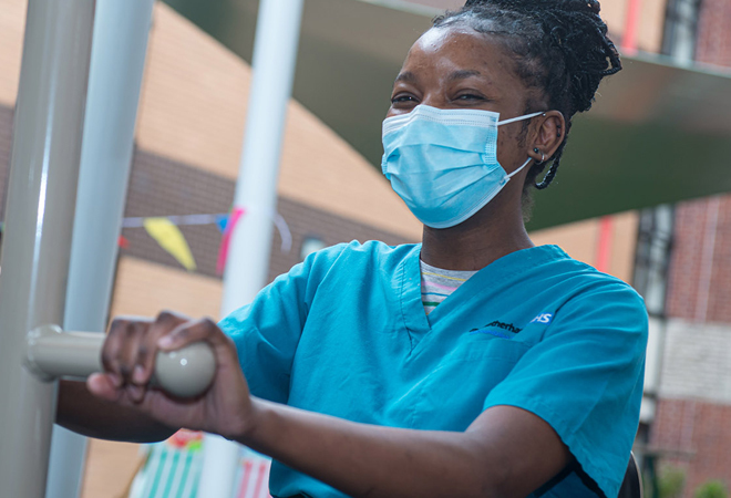 "Rotherham NHS staff member wearing a mask"