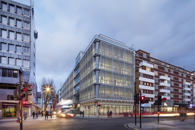 Photo of outside Grafton Way Building Hospital at night with buildings either side and photo taken from opposite side of road.