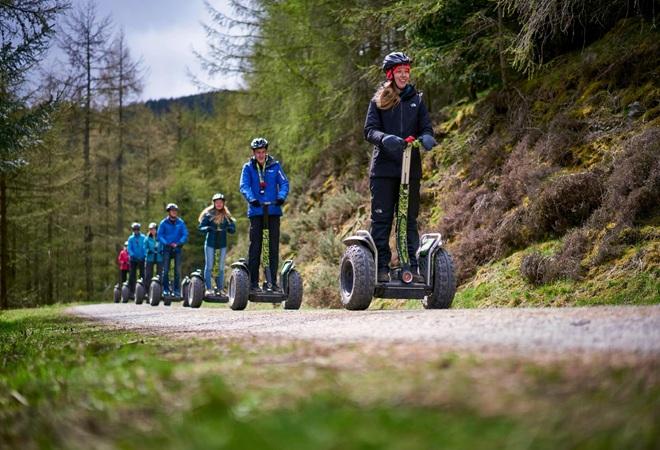 "Moors Valley - segway riders travelling along a path"
