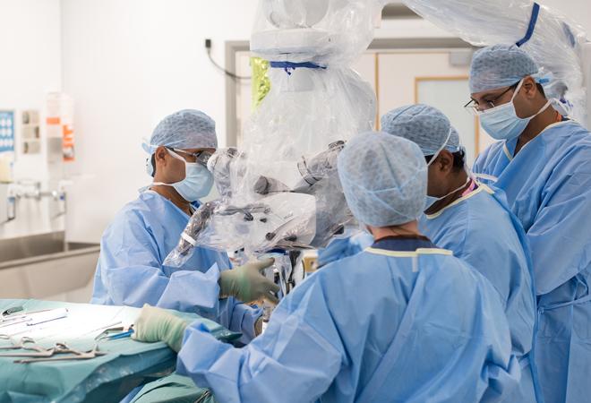 "Surgeons performing surgery"