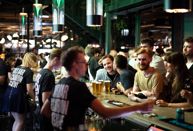 "Internal photo of a BrewDog bar, full of customers"