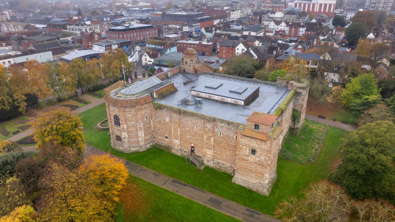  "Aerial view of Colchester Castle in Essex, with town in background"