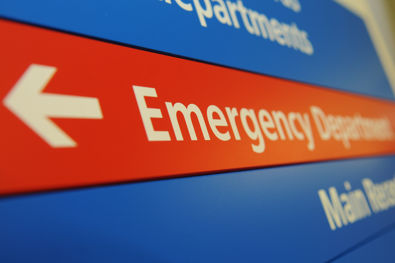 Photo of sign inside hospital pointing towards Emergency Department