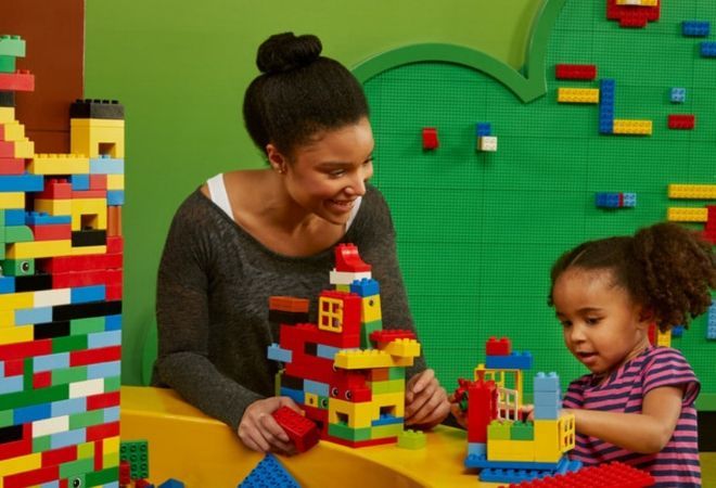 "little girl and women playing with lego"