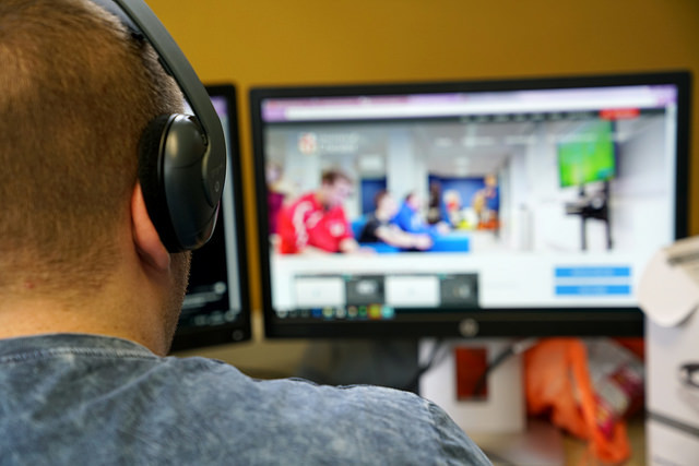 "Student carrying out work on computer"