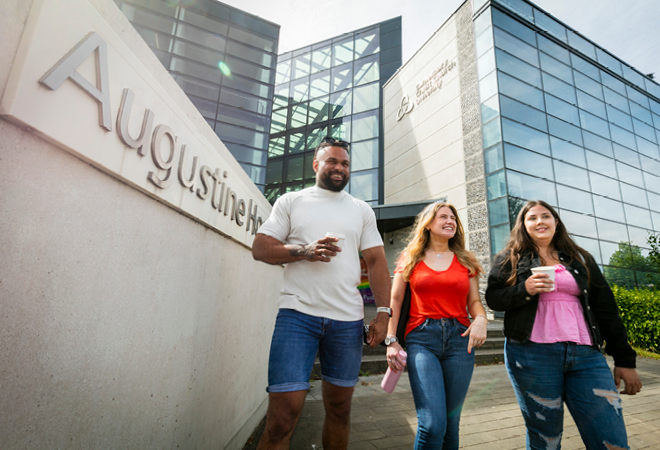 "Image of stUdents walking outside of Augustine House at CCCU"