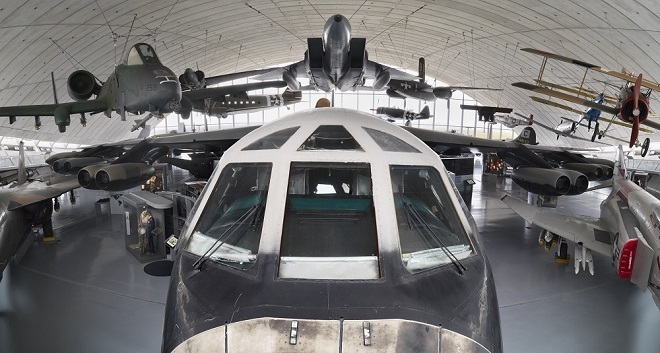 Photo of front of plane inside a hanger