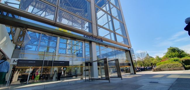 centre:mk car park from outside, glass building reflecting the sunshine