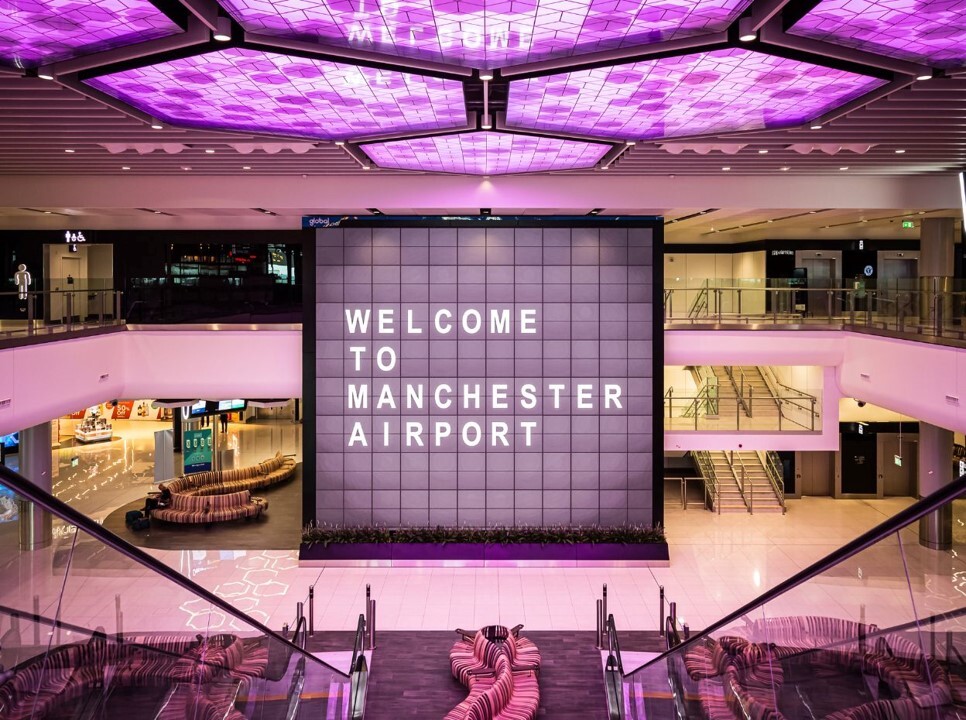 "Large sign in airport terminal which reads Welcome to Manchester Airport"