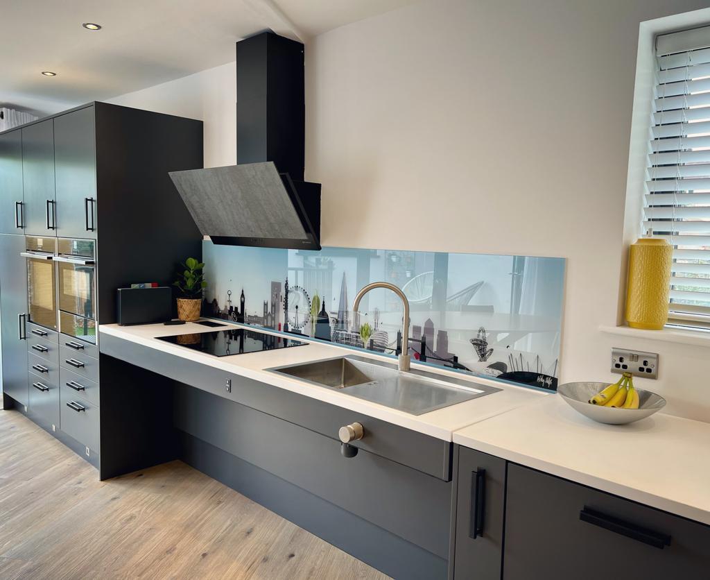 'kitchen with sink extractor fan and storage cupboards'