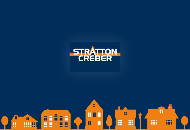"Stratton Creber logo on a blue background, orange houses across the bottom"