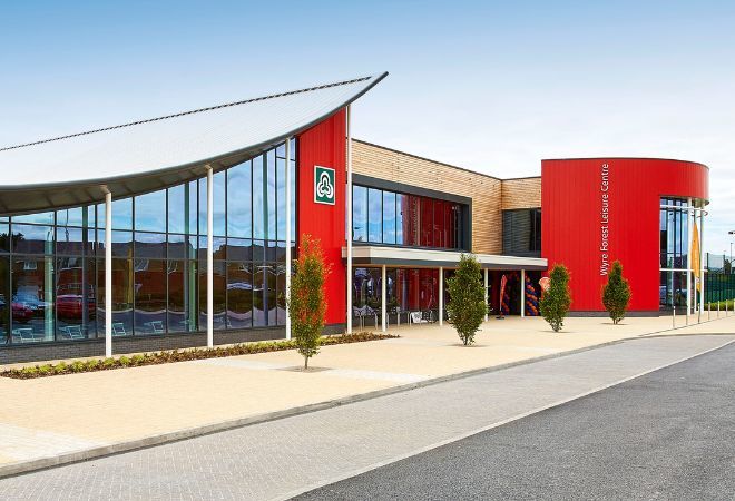 ''wyre forest leisure centre outside. trees showing in front of the building''