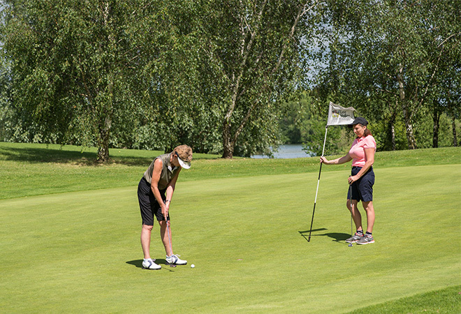 "A photo of some women playing golf"
