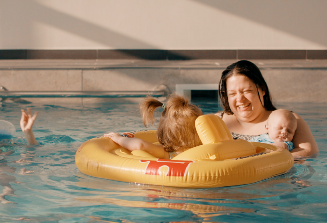 A family in a swimming pool