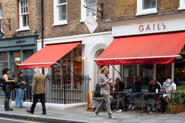 Seymour Place, outside Gale's Cafe, customers enjoying a hot beverage outside.
