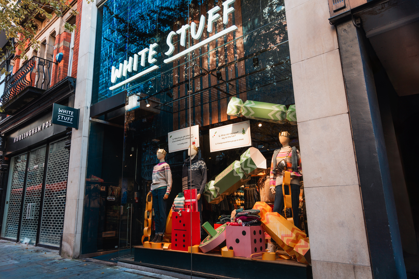 Outside view of a store with a Christmas display in the front window.