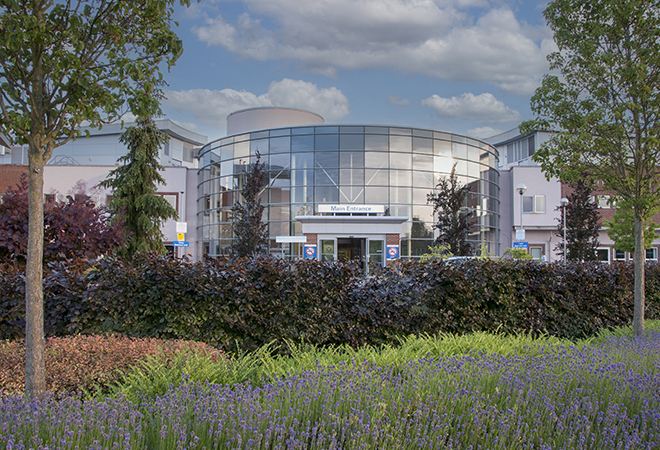 "Nuffield Orthopaedic Centre main entrance with trees and lavender in foreground"