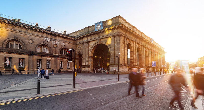 "Newcastle train station with setting sun in background"