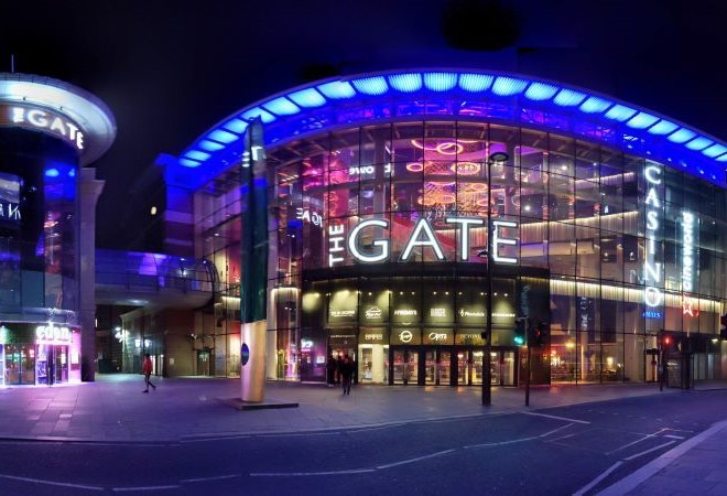 "Night time photo of the entrance to The Gate, taken from across the road"