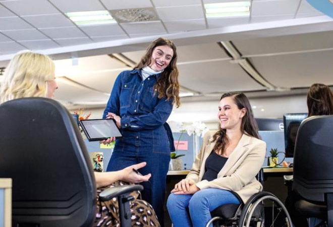 Demonstration on a tablet at the office, wheelchair user in attendance