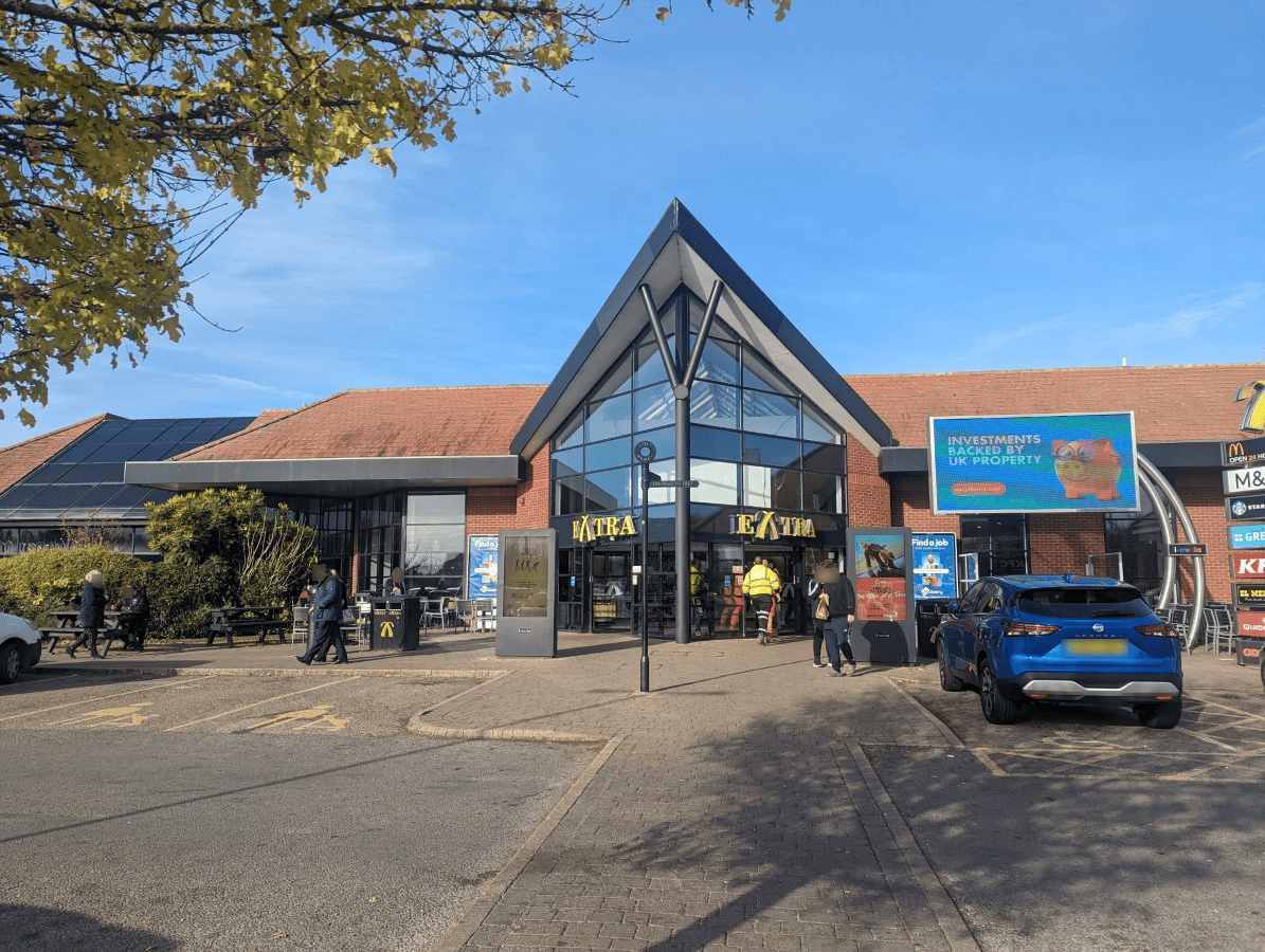 A picture showing the front of A1(M) Baldock Extra Services, with cars in the front
