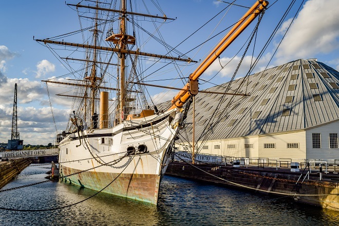 "Photo of Historic Dockyard Chatham. There is a small ship docked in water."