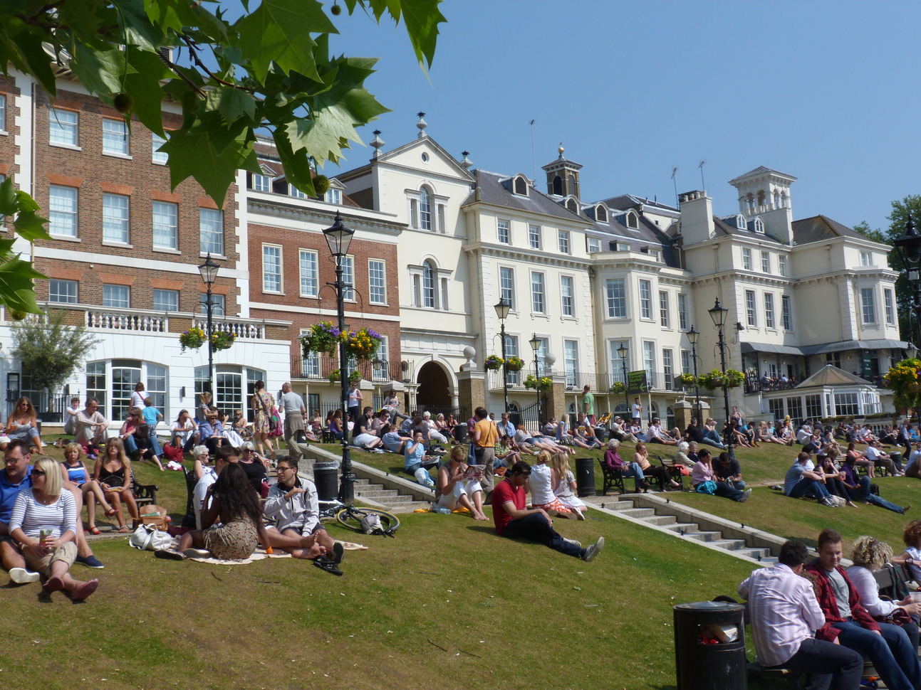 "People sitting in the banks of the river"