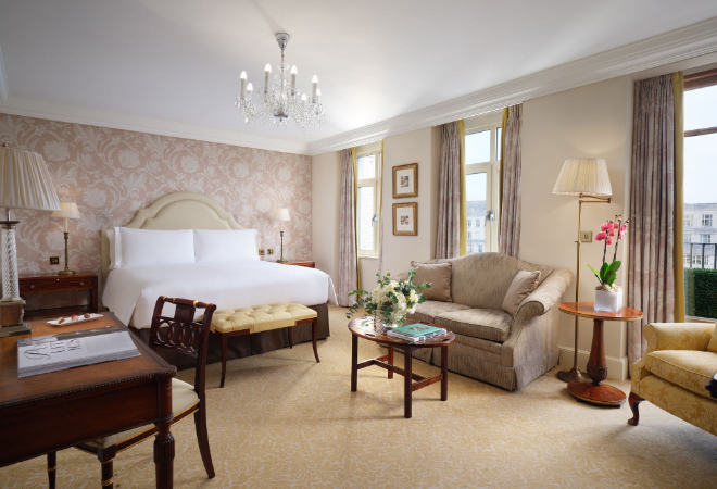 "bedroom with desk and sofa"