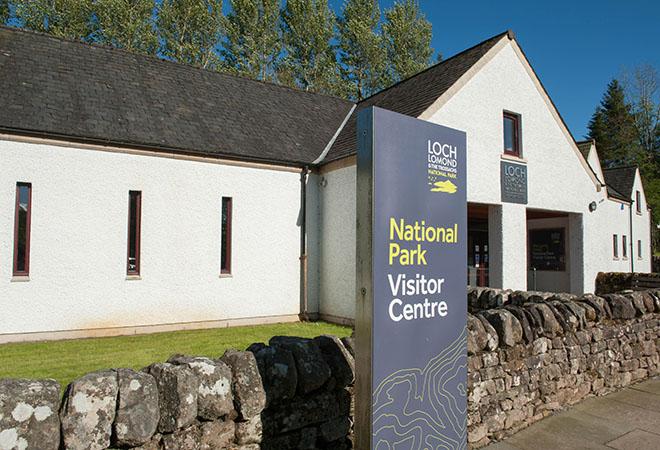 "white visitor building with blue sky"