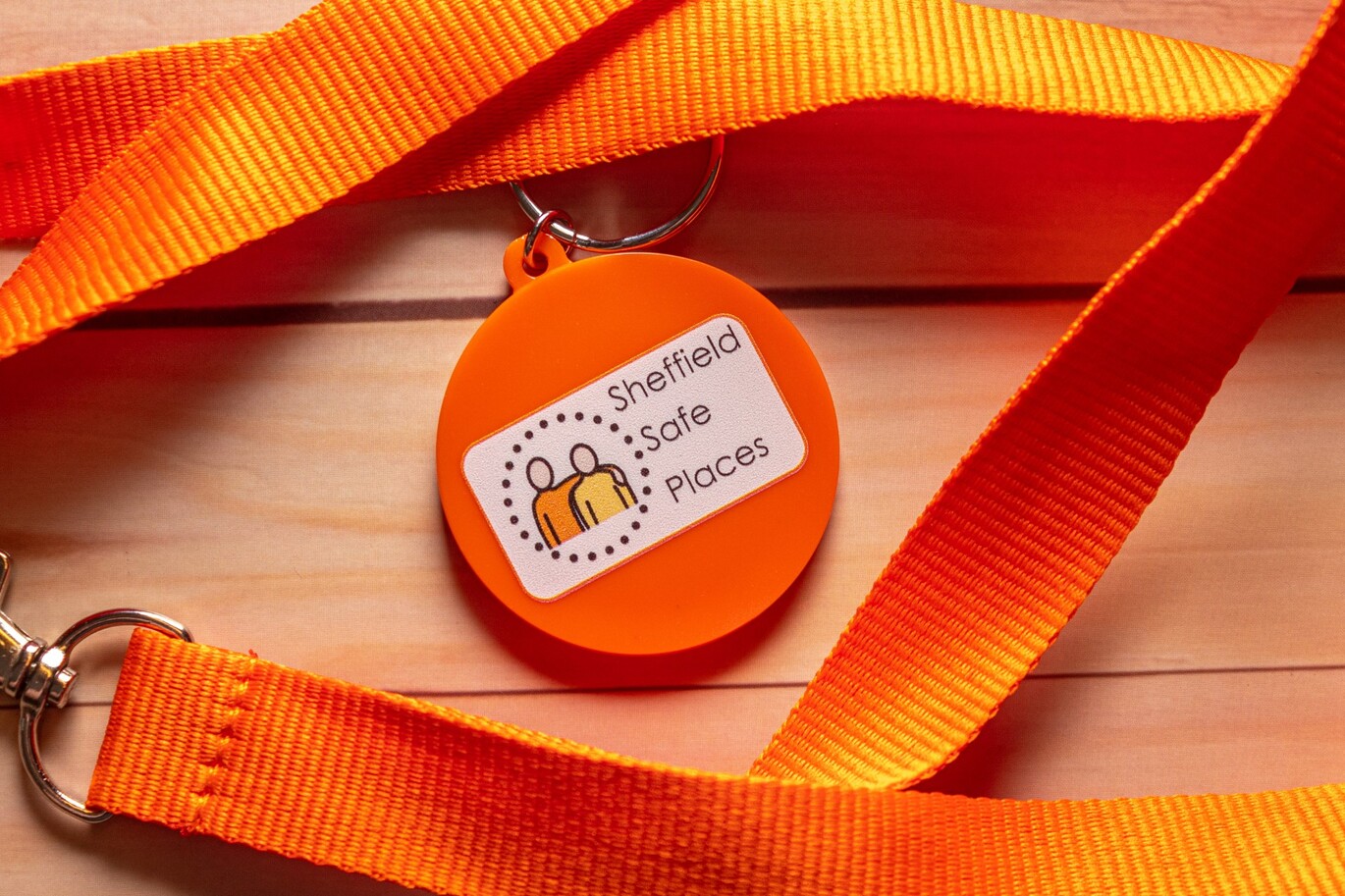 A lanyard with a keychain that says 'Sheffield Safe Places' with the logo