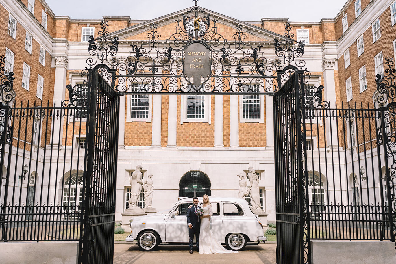 'Photo of married couple in front of BMA House'