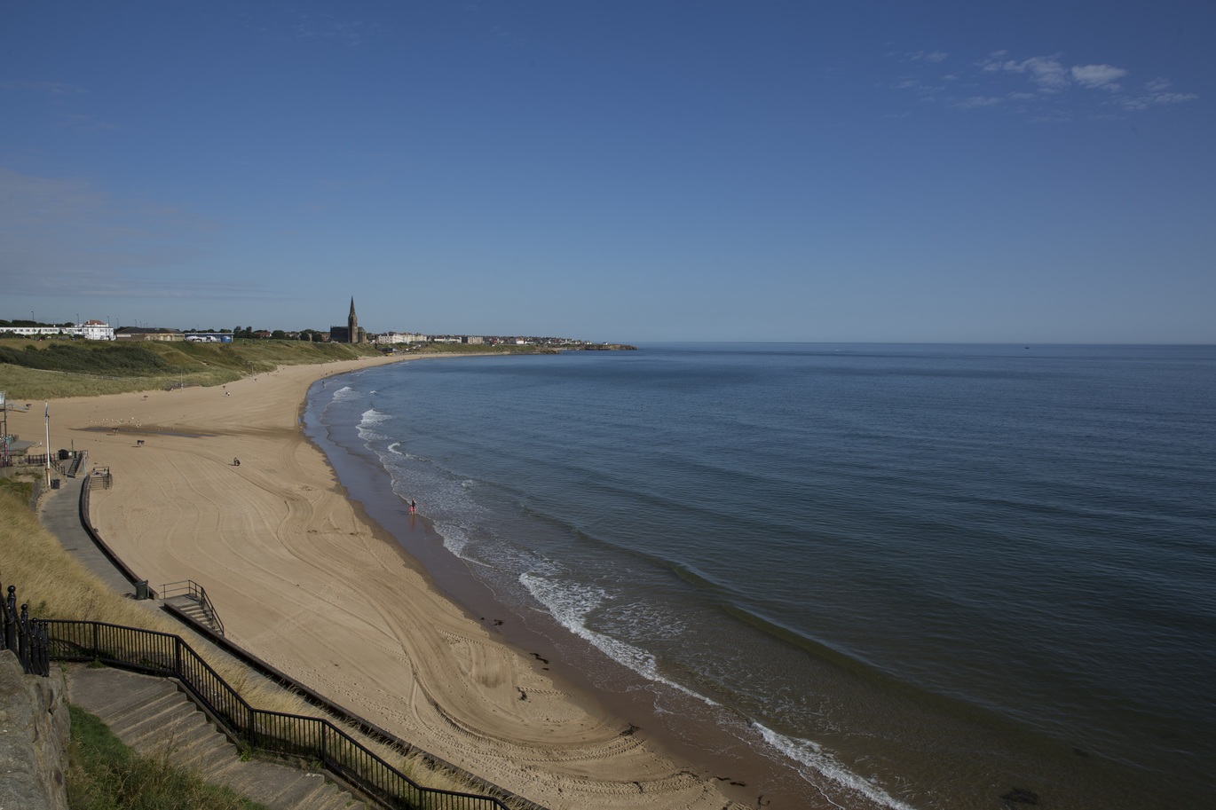 Photo of the sea meeting the sand