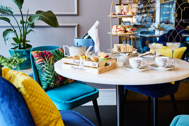 'seats and table with food and drinks on it' 