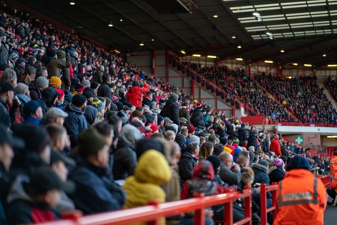 Photo of fans watching match
