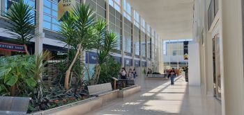 inside centre:mk white marble floors with greenery in the isles.