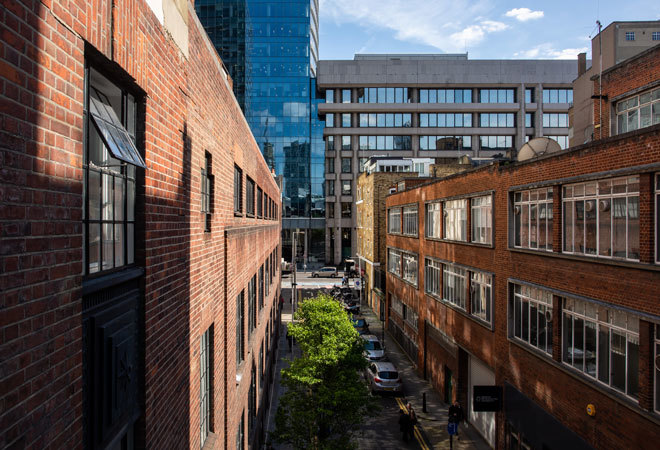 photo taken from height, looking down an small side road of London Met