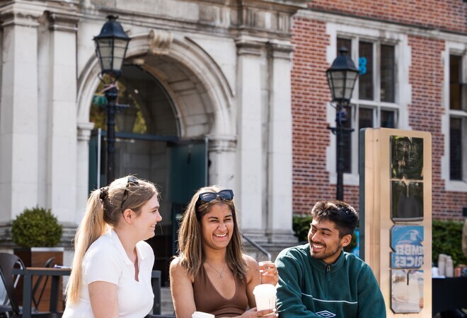 Students in conversation outside the Student Union