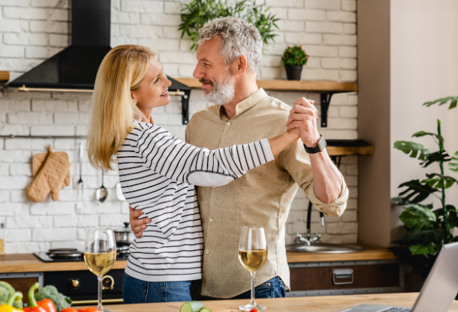 A couple dancing in their kitchen
