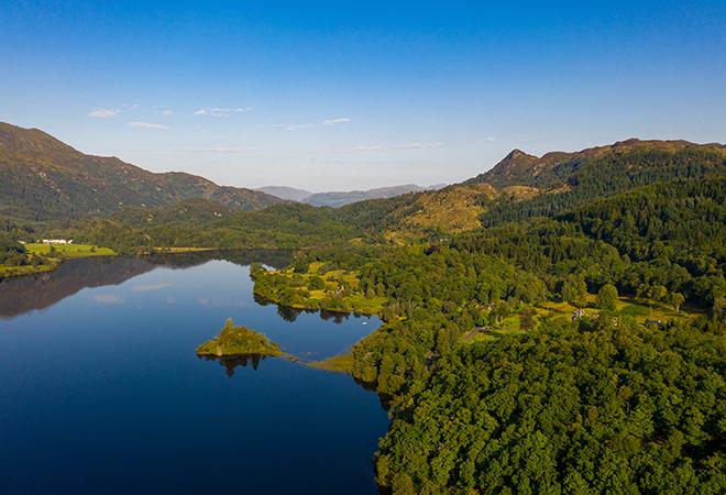 "birds eye view lake and forest"